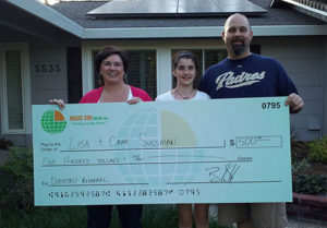 Residential family receiving money for solar panel referral.